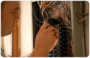 Man fixing the electrical panel